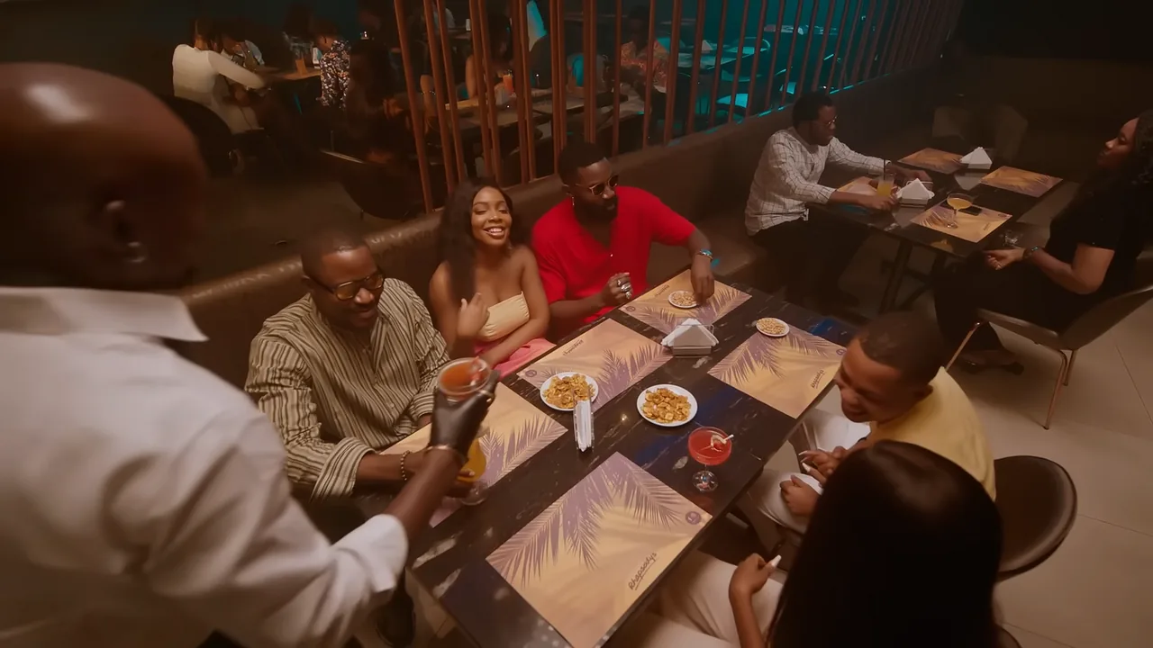 Promoted film still: friends share Chivita at dinner